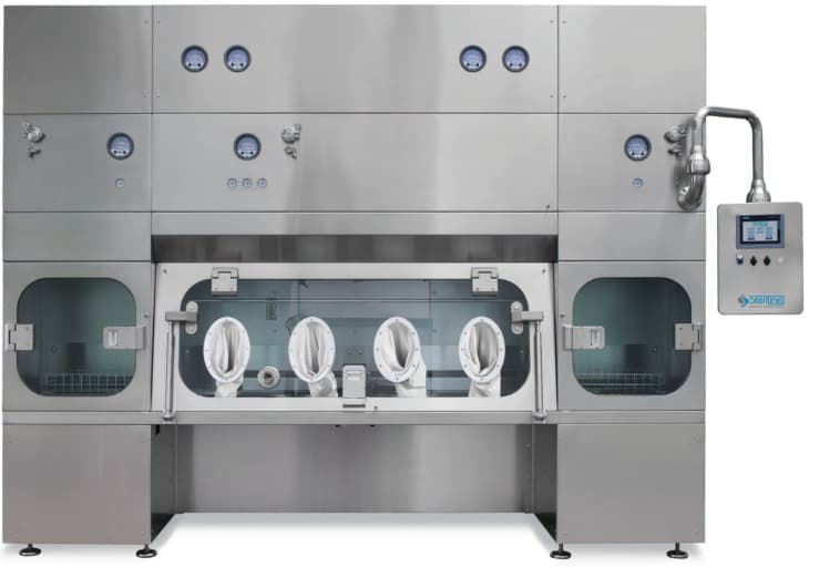 A pharmaceutical isolator with glove ports and a control panel.